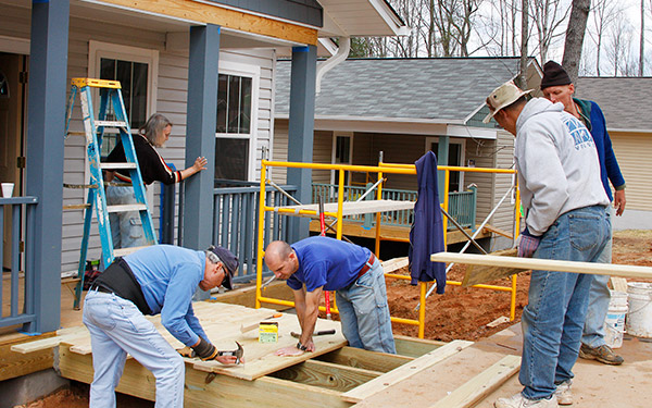 People building a house