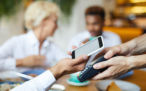 Man using a cellphone to pay